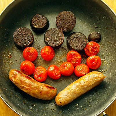 Black pudding, cherry tomatoes and sausages