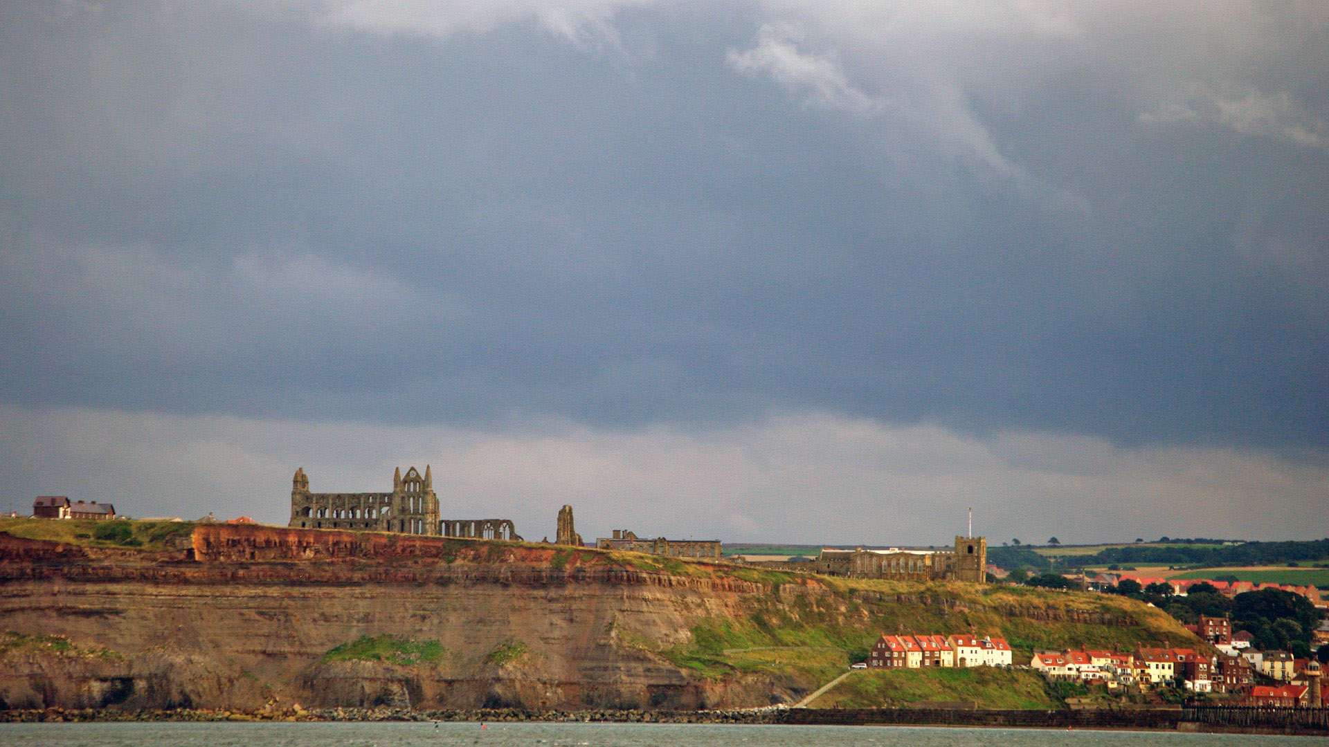 whitby east cliff Whitby from sea ruins Whitby Abbey St Marys church